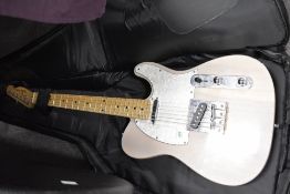 A Fender Telecaster style electric guitar by by Harley Benton with a cream white body colour.