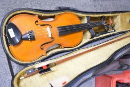 A modern violin, made in workshops of Andreas Zeller for Stentor, with fitted case and P & H bow etc