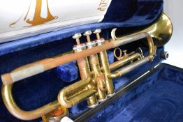 A B & M Champion brass trumpet, with fitted case etc