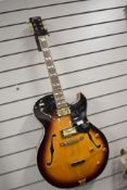 A Vintage VSA-575-TS hollow body archtop electric guitar