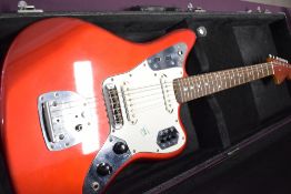 Fender Jaguar Candy Apple Red with matching headstock. Serial No S039937 (1994?) Crafted in Japan.