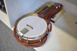 A vintage 'George Formby' , ukulele banjo bearing transfer signature to headstock, with soft case