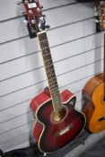 A Freshman electro acoustic guitar in wine red, model FA1AWR, fitted with Fishman pre amp system,