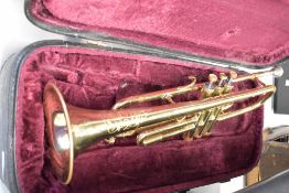 A Corton brass trumpet in fitted case