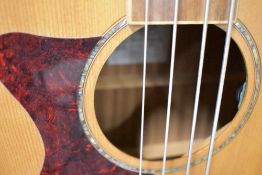 An as new Tanglewood electro acoustic bass guitar , left handed , model TW155A s/n YU140804043 (no