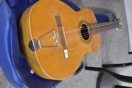 A vintage Spanish guitar, labelled Hijos De Vicente Tatay, SRC, heavy signs of wear, with vinyl