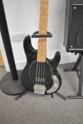 A Stag 'musicman' style bass guitar, sold with guitar stand