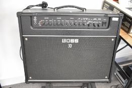 A Boss Katana Artist 100Watt 1 x 12 amplifier , sold with amp stand