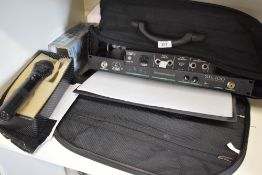 An AKG SR100 wireless receiver, C5900 microphone and an EV S-200 equalizer, sold with carry bag