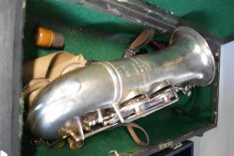 A Rampani and Cazzani , Saxphone, engraved Jepson, Eb HP , serial number 3039, with fitted wooden