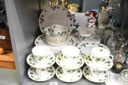 A Royal Albert 'Colclough' fine bone china tea service having semi scalloped rim and gold rim,
