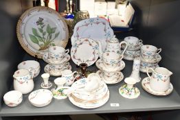 A Staffordshire 'Blue Bow' pattern fine bone china dinner service, decorated with floral designs