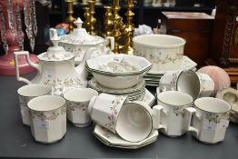 A 36 piece tea service having green colour edging and floral patterns on a white ground, to