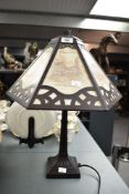 An Art Deco style lamp decorated with various churches, to include St. Mary's Roman Catholic