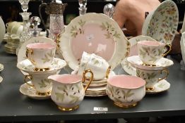 A Royal Albert 'Braemar' pattern tea service, decorated with gilt edges and floral patterns, to