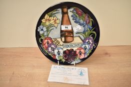 A limited edition Moorcroft Contennial plate designed by Rachel Bishop, painted and impressed