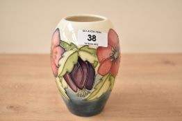 A Moorcroft pottery vase of lobbed form, designed by Rachel Bishop, decorated with tubeline floral