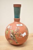 An Aesthetic style terracotta vase of bottle form, having green neck, the body decorated with bird