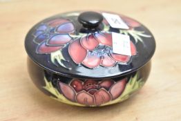 A Moorcroft pottery 'Anemone Flower' pattern bowl with cover, impressed and painted marks to base,
