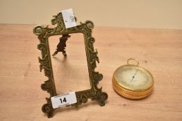 An early 20th century Negretti & Zambra altimeter, H7cm, sold together with a brass frame, (2)