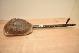 A tortoiseshell Gunibri guitar, the neck decorated with geometrical folk art patterns, L58cm