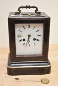 A 19th century French mantel clock, by Martin Baskett, Paris, having a brass carrying handle over