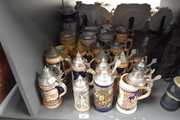 A quantity of Marzi & Remy lidded beer stein's, decorated in a variety of scenes including tavern
