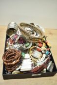 A large assortment of costume jewellery, including bracelets, shell jewellery, beaded necklaces