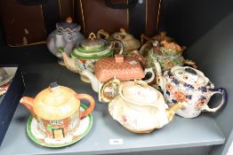 A Royal Devon blush ivory tea pot decorated with floral patterns, gilt handle and spout, L24cm, sold