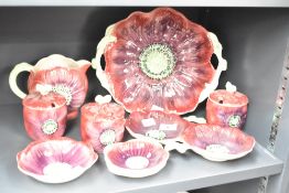 A quantity of Staffordshire Shorter & Sons ceramic dinner/tea wares, hand coloured with poppy