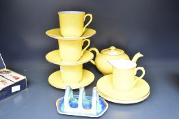 A vintage Shelley yellow tea service decorated with gilt edging, comprising of tea pot, cream jug, 6