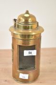 An early 20th century brass ship lantern having glass aperture and wooden handle, h20.5cm