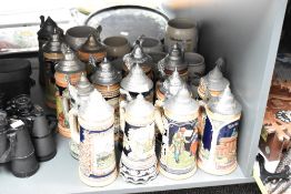 A quantity of Marzi & Remy lidded beer stein's, decorated in a variety of scenes including tavern