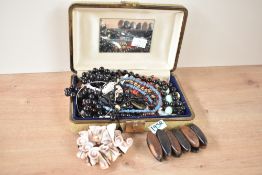 A green faux leather jewellery box, containing a collection of costume jewellery including beaded