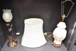 A patinated metal Art Nouveau style figural table lamp having frosted floral stylised globe, h46,