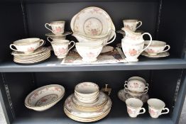 A Royal Doulton 'Canton' pattern dinner service, decorated with gilt edge and floral patterns on a