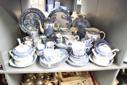 A large quantity of blue and white dinner ware, to include names such as Burleighware, Royal Doulton