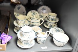 A Pembroke bone china childrens tea service decorated with blue foliage on a white ground, sold
