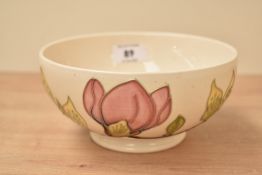 A Moorcroft 'Magnolic' pattern bowl raised on a circular foot, painted and impressed marks to