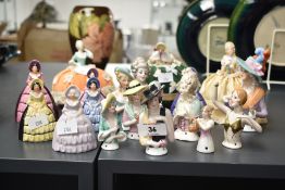 Three early 20th century doll pincushions, largest w12cm, sold together with a quantity of ceramic
