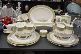 A Royal Doulton 'Sonnet' pattern dinner service, having gilt edges and floral designs, to include