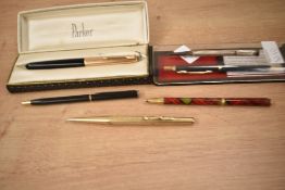 A selection of fountain and ballpoint pens and propelling pencils. including a boxed Parker 51 in