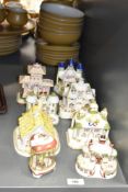 A Coalport ceramic Gingerbread House, hand coloured, makers mark to base, h9.5cm, sold together with