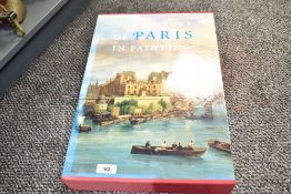 A large book with sleeve titled 'The History of Paris in Painting' by Georges Duby and Guy