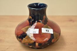 A Moorcroft pottery 'pomegranate' pattern vase of squat form, painted and impressed marks to base,
