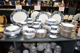 A Wedgwood 'Blue Siam' pattern dinner service, having gilt border and floral designs, to include