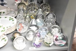A quantity of glass dump paperweights, to include a set of 3 controlled bubble paperweights ect, (