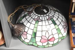 A Tiffany style shade having pink, green and white floral patterns, w39cm