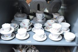 A Shelley 'Wild Flower 13668' pattern tea service, decorated with blue egdes and floral patterns, to