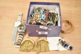 An assortment of costume jewellery, including a gold plated hinge bangle, faux pearls,